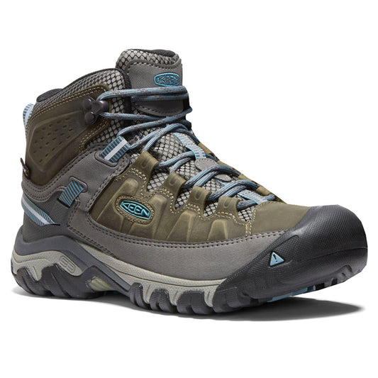 Green high-top hiking boot with blue-grey laces and lugged sole