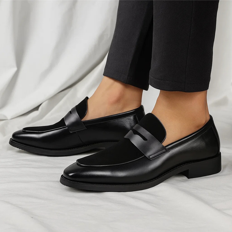 Men's navy and black penny loafers with almond toes and low heels