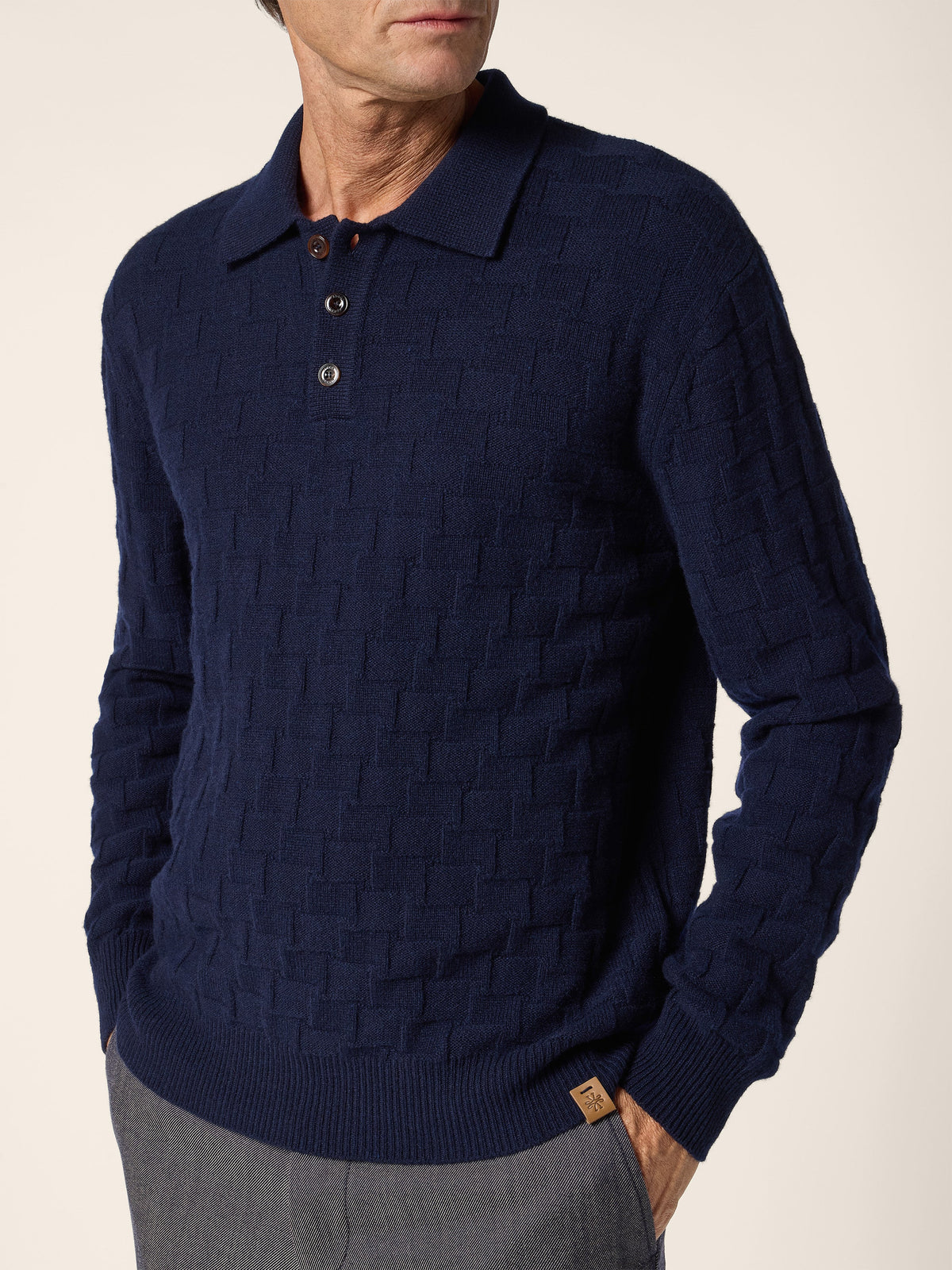 Unisex houndstooth polo shirt with a collared neckline