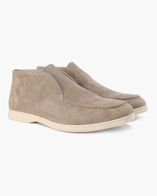 Unisex ankle-height slip-on loafers with rounded moc toes and stitched apron details