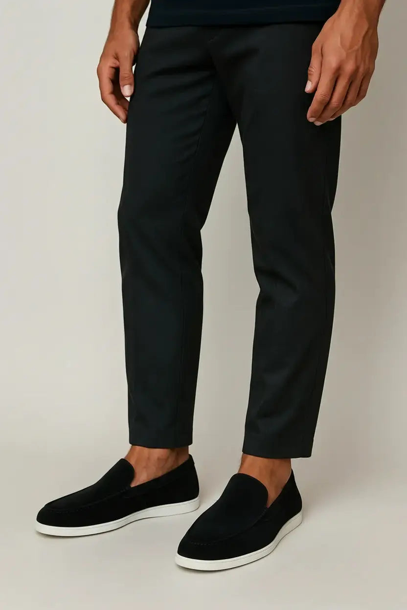 Black and navy suede loafers with cream sole and moc-toe stitching