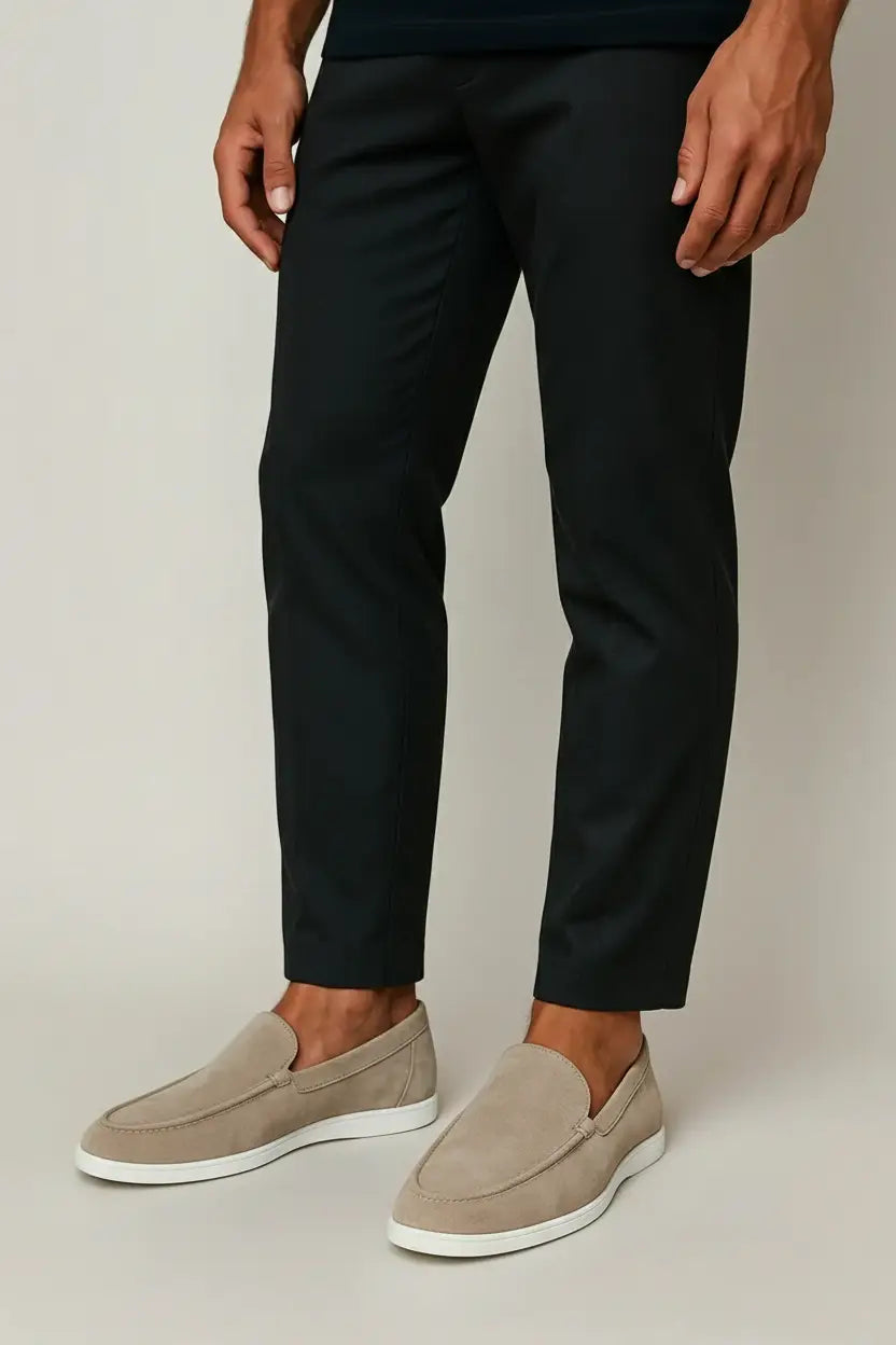 Black and navy suede loafers with cream sole and moc-toe stitching