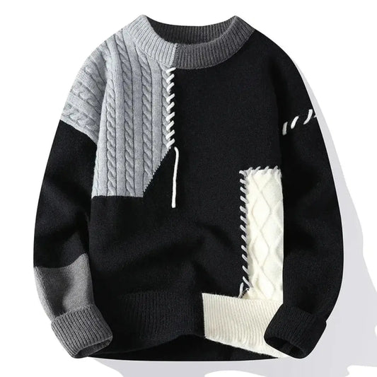Patchwork cable knit sweater with contrasting panels and crew neckline