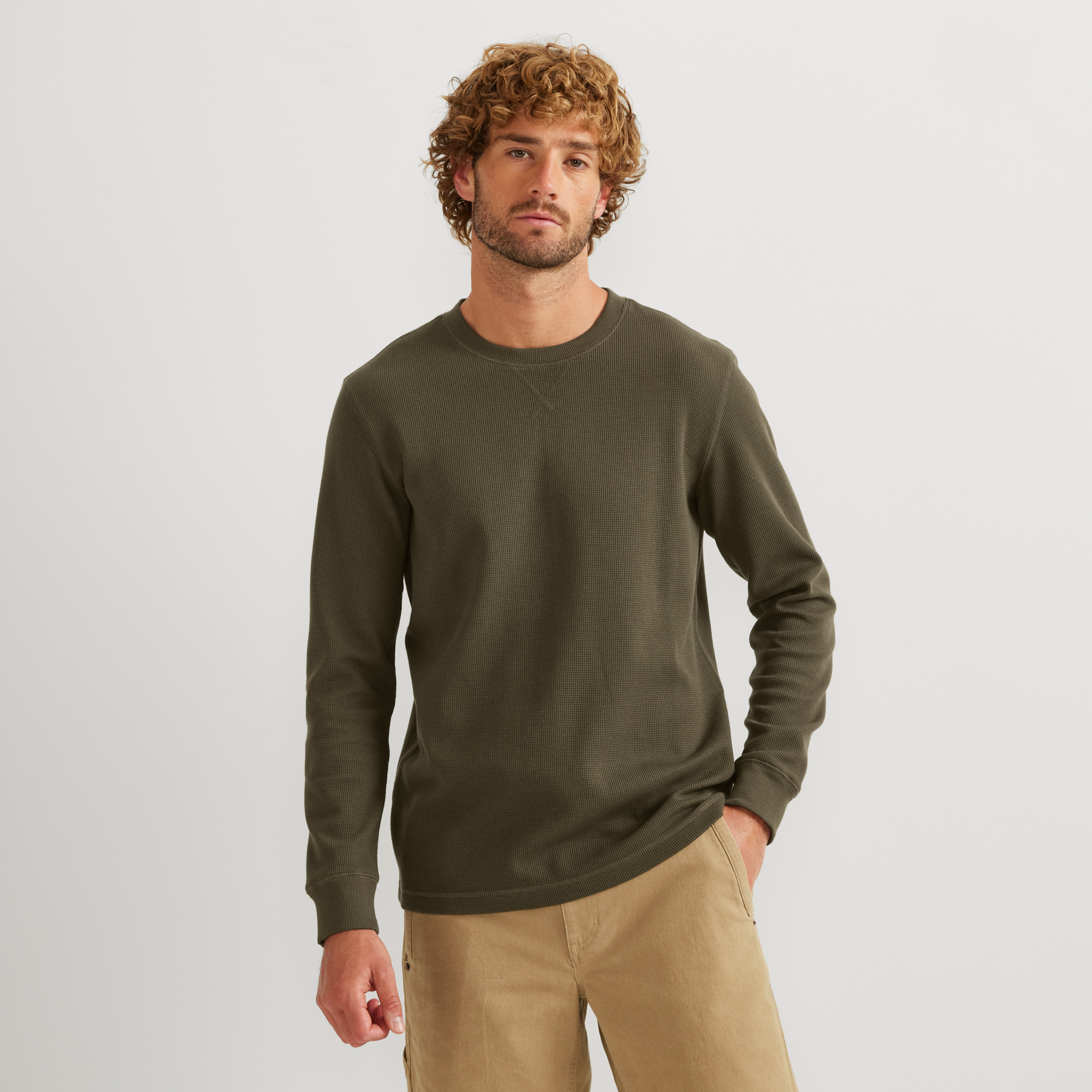 Men's crew neck long sleeve top with fine ribbed texture and ribbed cuffs