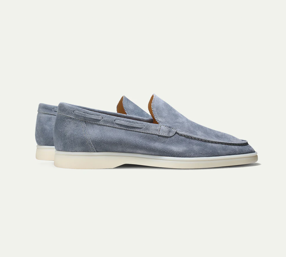 Men's slip-on loafers with moc-toe stitching and flat soles