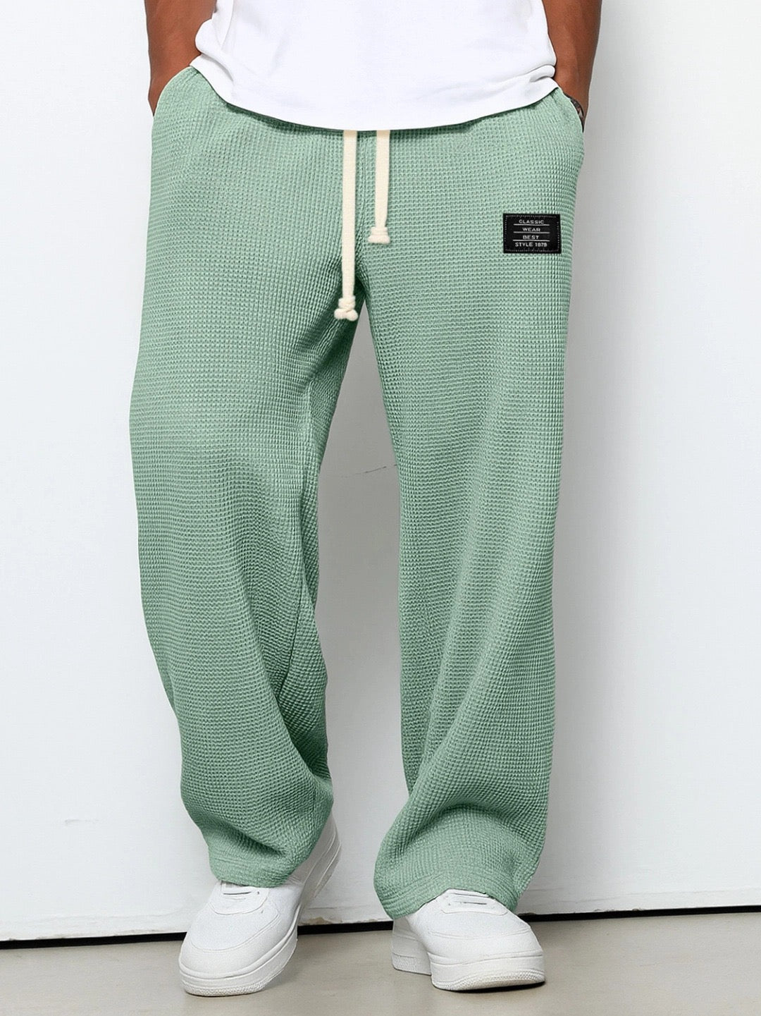 Men's wide leg textured trousers with drawstring waist, shown in blue and cream variants