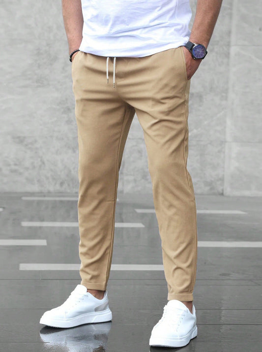 Men's tapered pull-on trousers with elasticated drawstring waist and side pockets