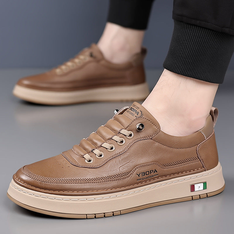 Low-top lace-up trainers with stitched panels and a contrast sole