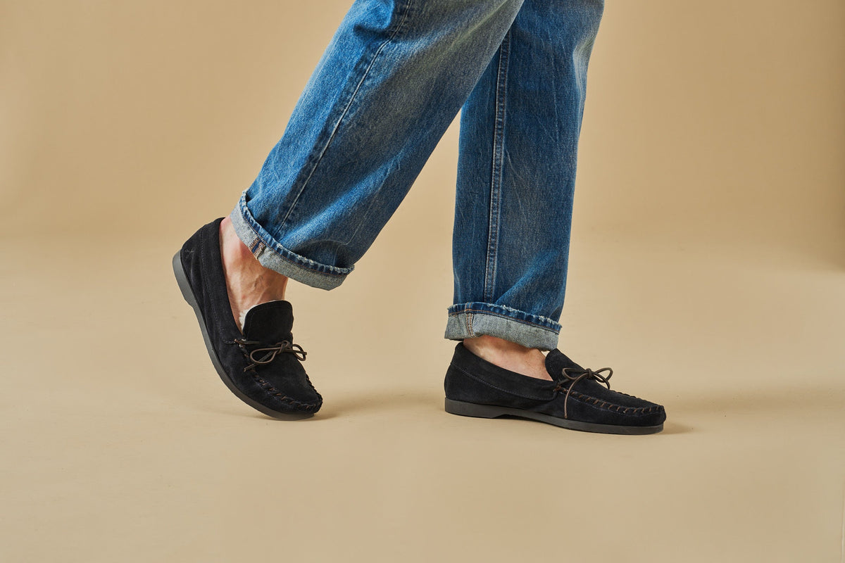 Men's navy suede moccasin loafers with lace detail and flat soles