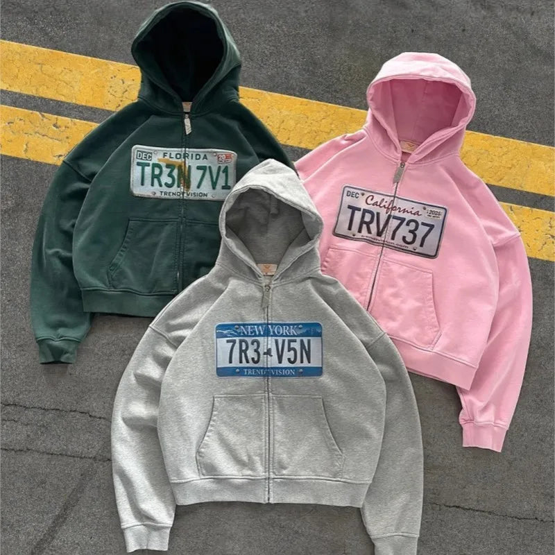 Cropped hooded zip hoodie with license plate chest graphic
