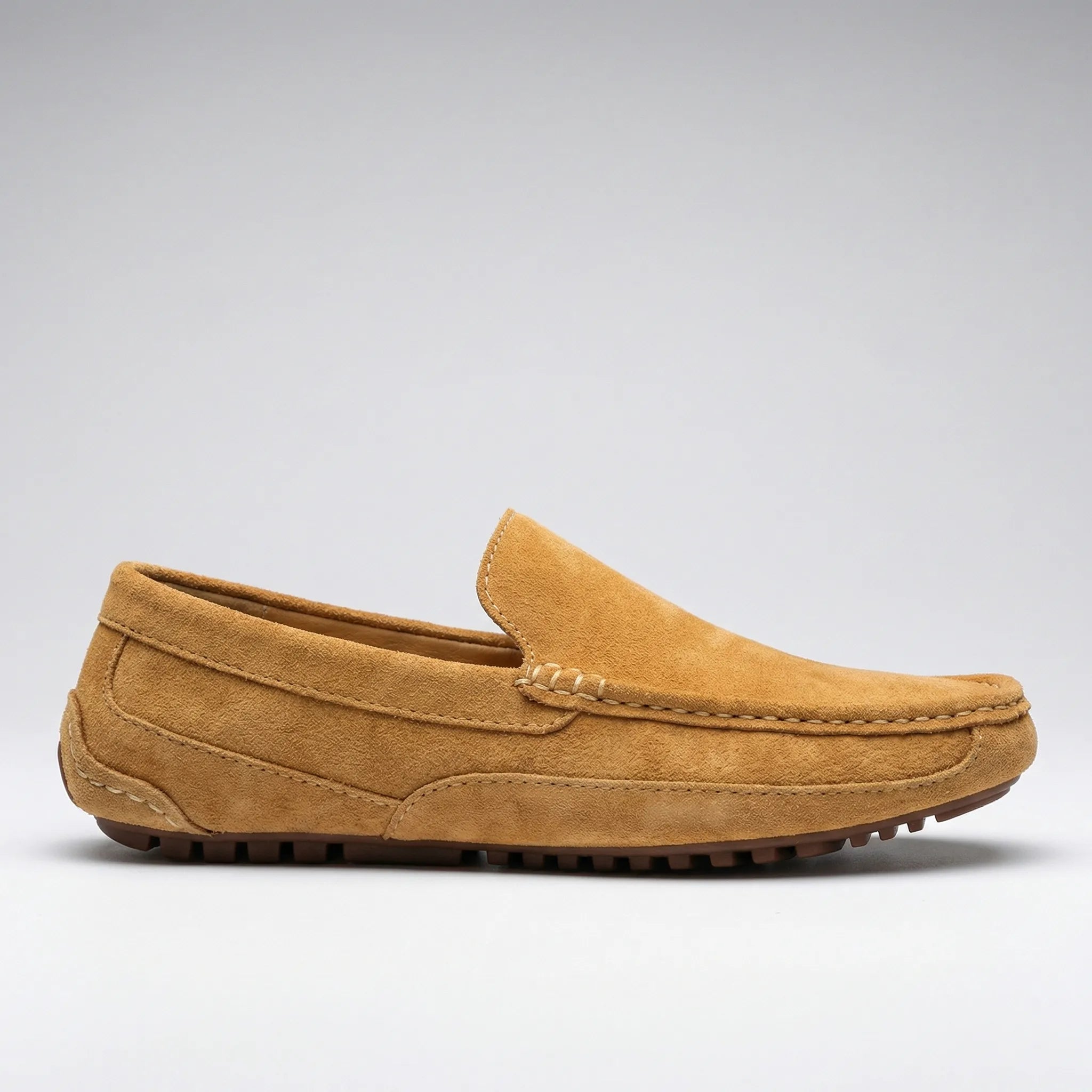 Men's slip-on moccasin loafers with stitched trim and ridged soles