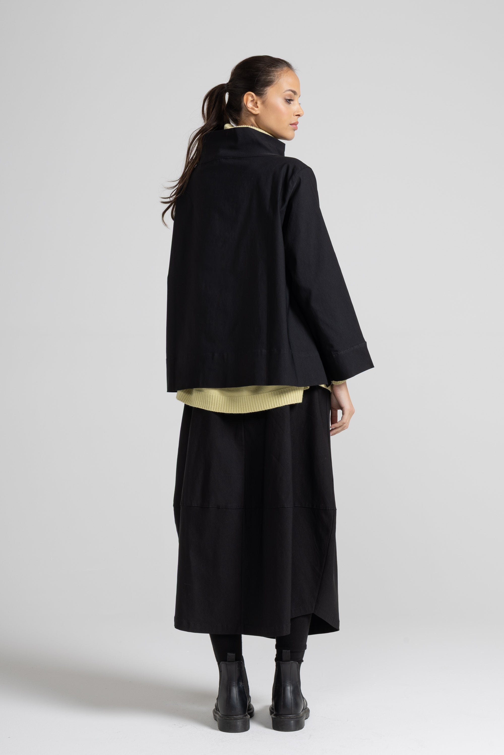 Women's navy asymmetric short jacket with long sleeves and button front closure