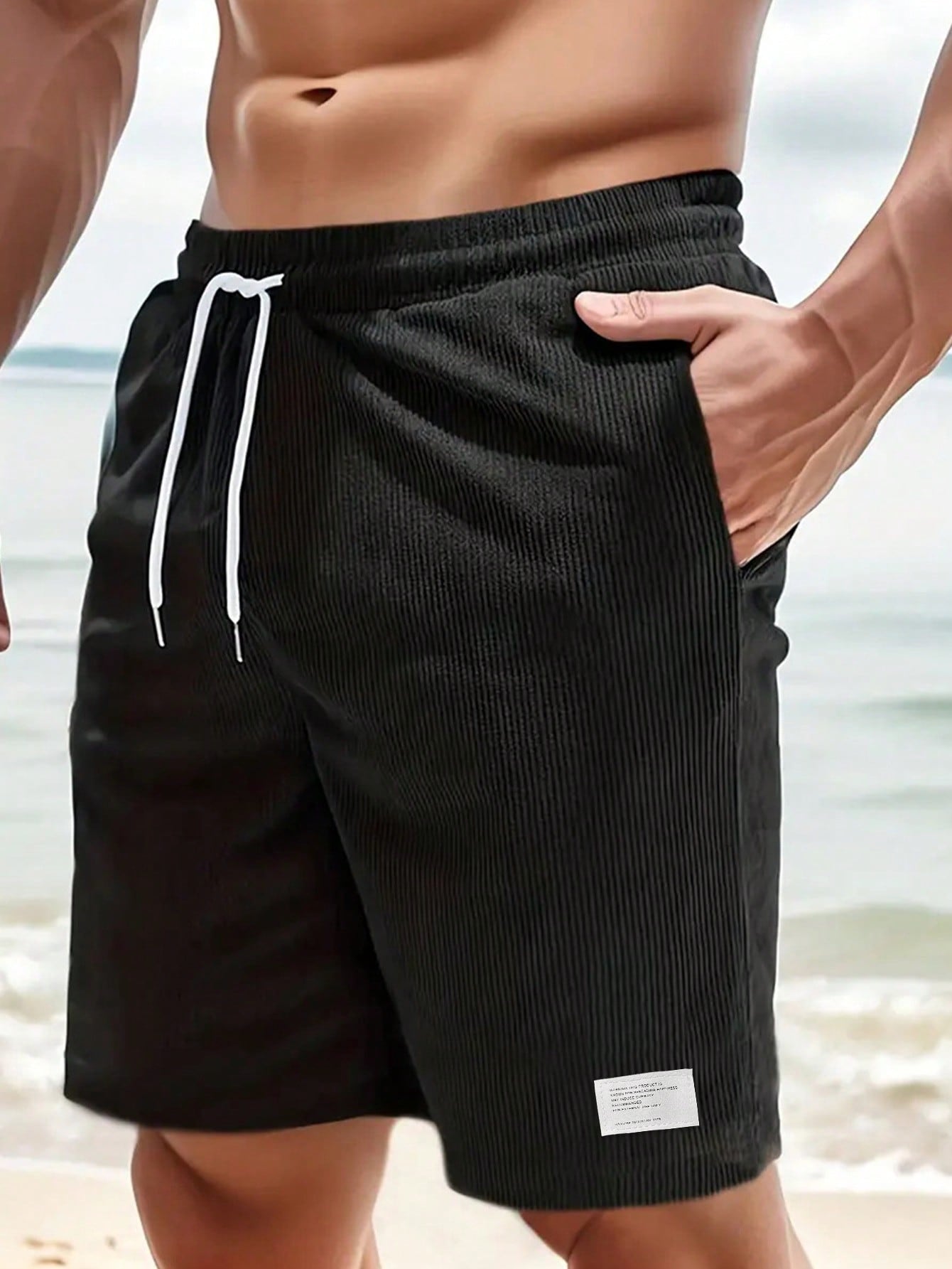 Men's relaxed fit shorts with elastic waist and drawstring, shown in green and beige