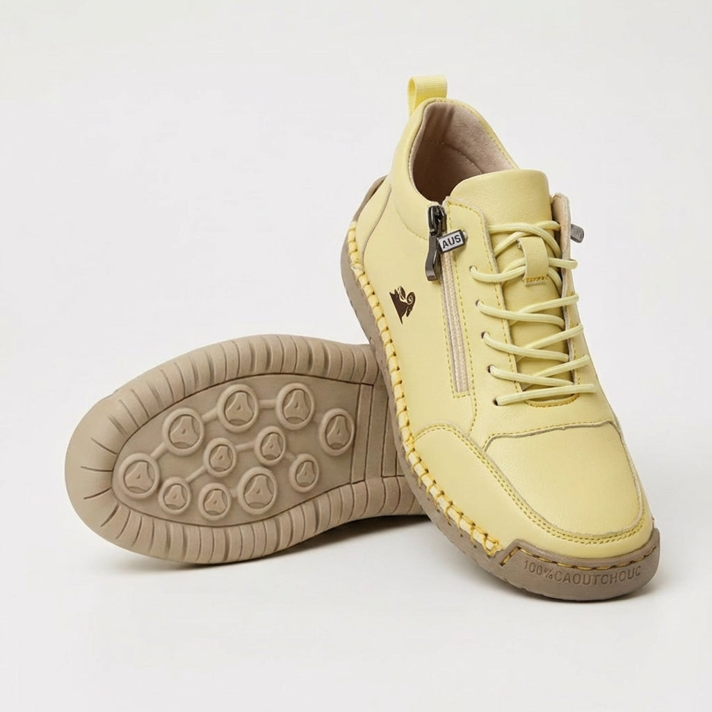 Lace-up ankle sneaker with side zip, shown in tan and pink colorways with padded collar