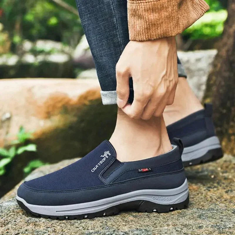 Men's slip-on walking shoe with textured upper, layered sole and treaded outsole