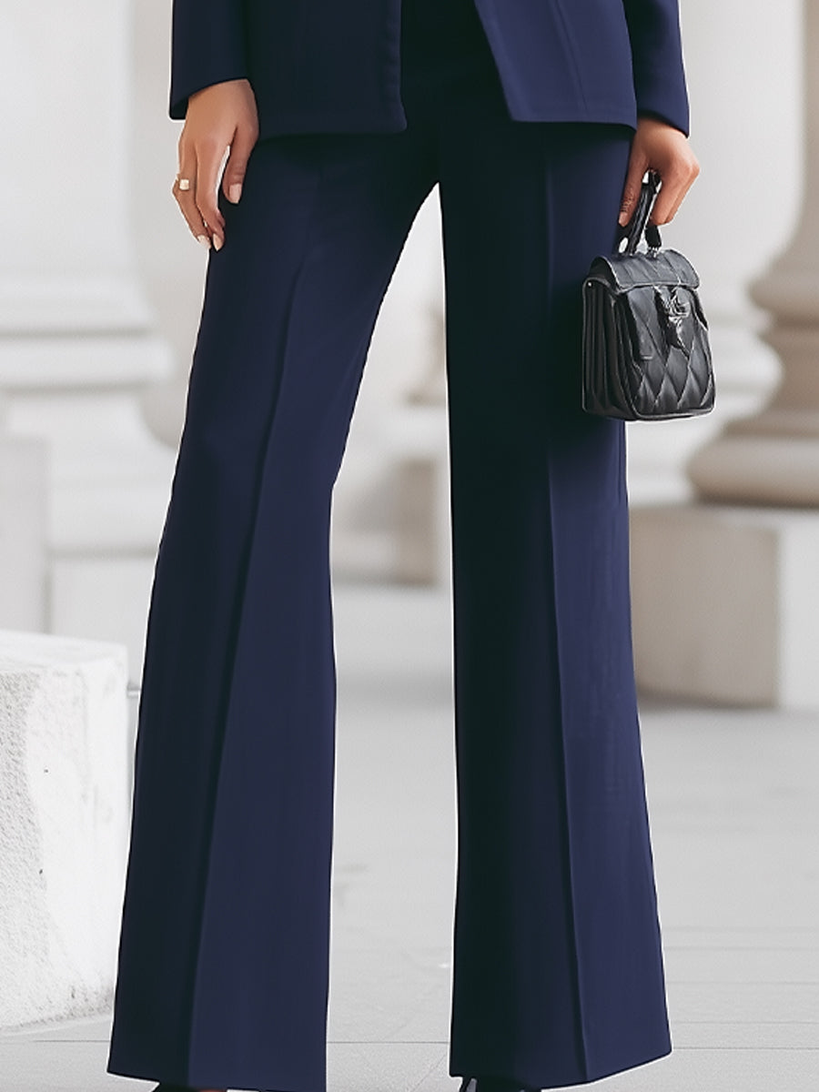 Women's tailored blazer and wide-leg trouser suit set in navy and white, high collar