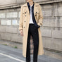 Men's long double-breasted trench coat with belt, buttoned pockets and checked lining