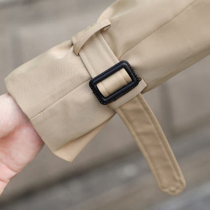 Men's long double-breasted trench coat with belt, buttoned pockets and checked lining