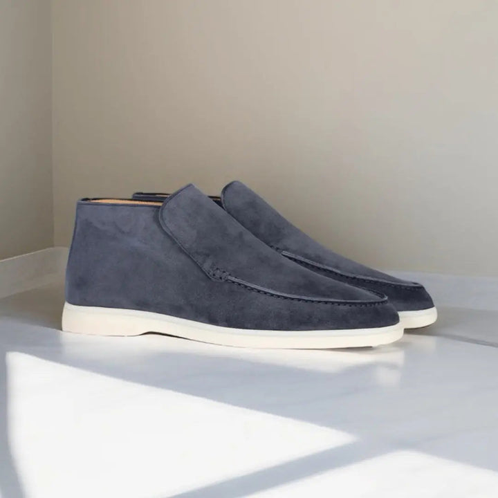 Men's slip-on loafers with stitched moccasin detailing and flat contrasting soles