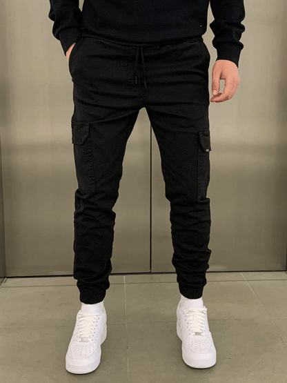Men's tapered cargo trousers with drawstring waist, thigh pockets and elasticated cuffs