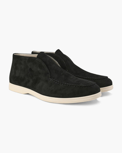 Unisex ankle-height slip-on loafers with rounded moc toes and stitched apron details