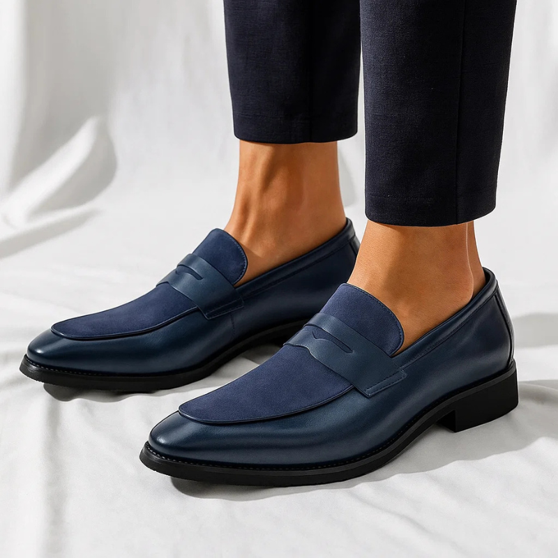 Men's navy and black penny loafers with almond toes and low heels