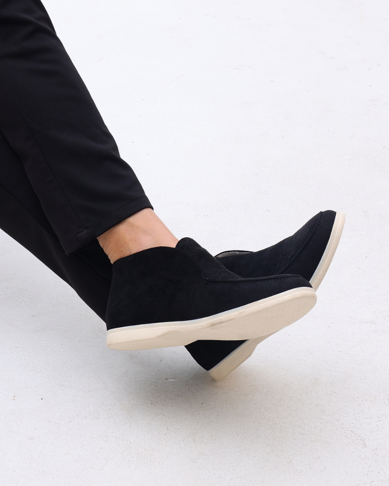 Unisex ankle-height slip-on loafers with rounded moc toes and stitched apron details