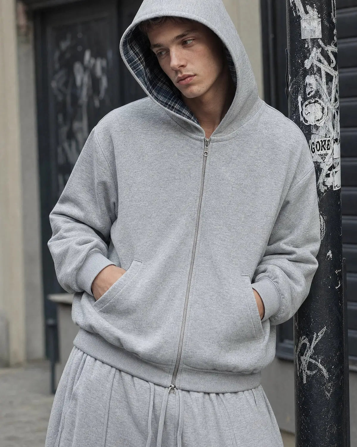 Grey reversible cropped hoodie with checked lining, hood and zip front
