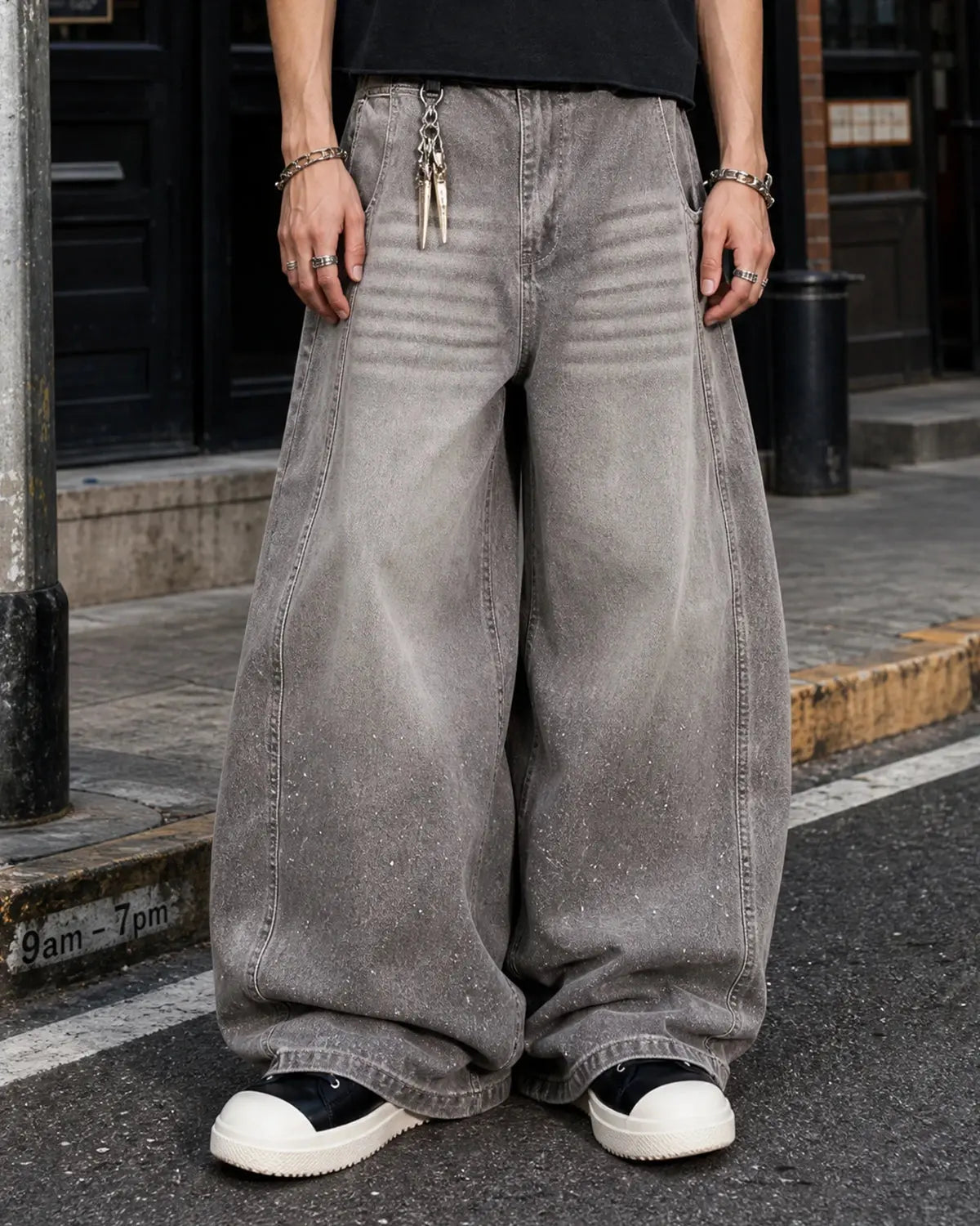 Light grey washed barrel-leg jeans with rhinestone embellishments