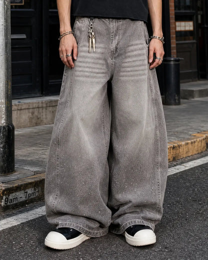 Light grey washed barrel-leg jeans with rhinestone embellishments