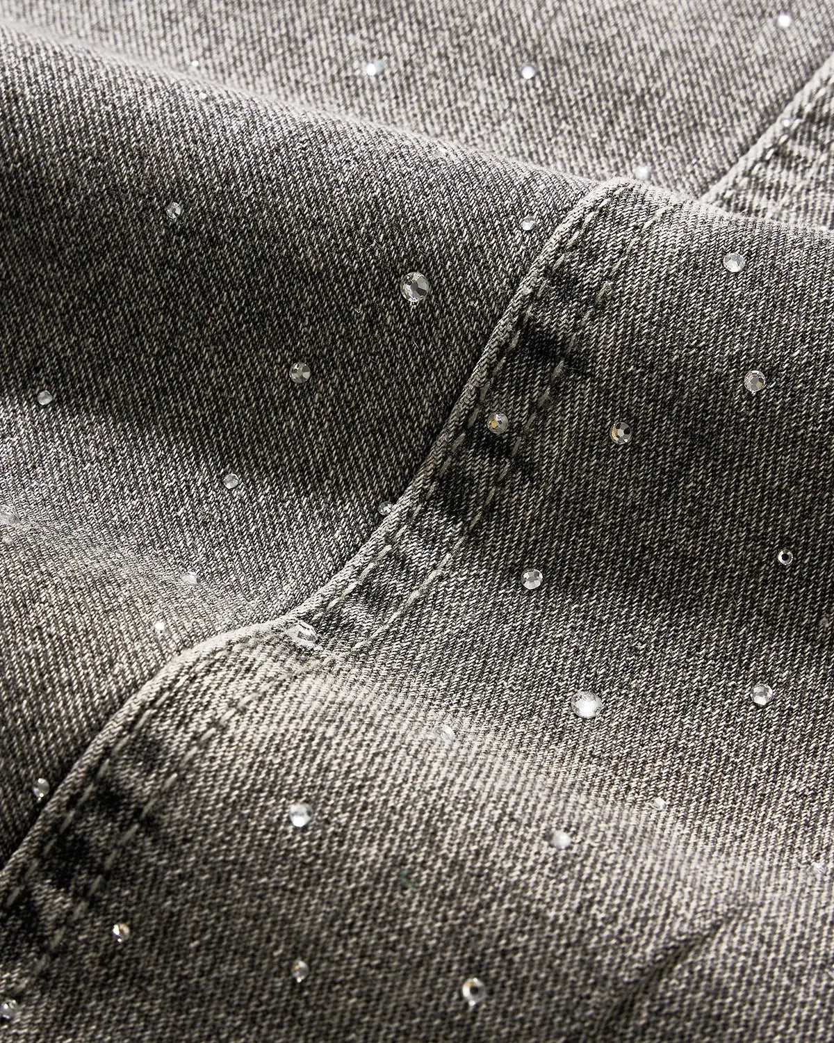 Light grey washed barrel-leg jeans with rhinestone embellishments