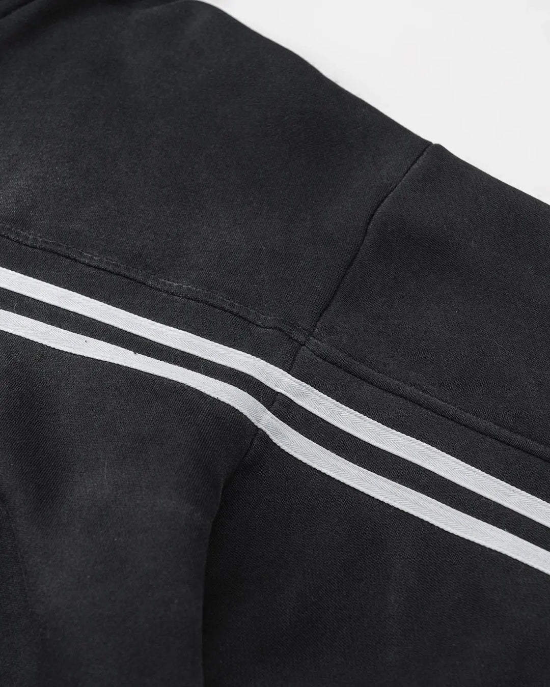 Black acid wash zip-up hoodie with white chest and sleeve stripes