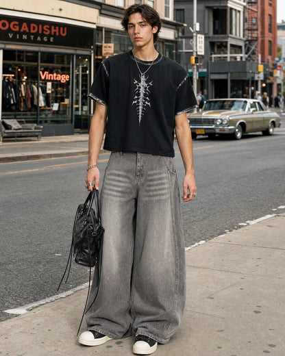 Light grey washed barrel-leg jeans with rhinestone embellishments