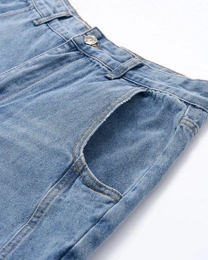 Light blue barrel-leg jeans with black script graphic and five-pocket design