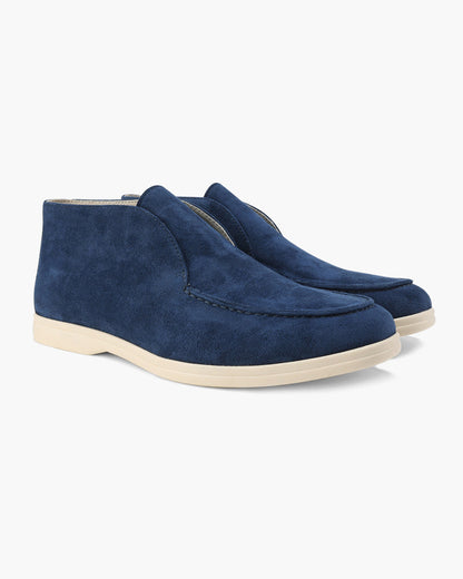 Unisex ankle-height slip-on loafers with rounded moc toes and stitched apron details