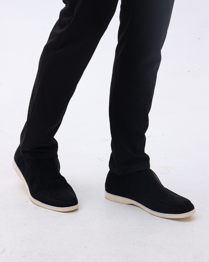 Unisex ankle-height slip-on loafers with rounded moc toes and stitched apron details