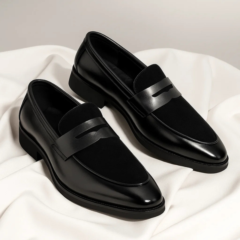 Men's navy and black penny loafers with almond toes and low heels