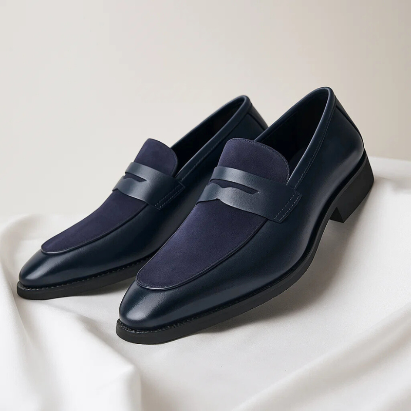 Men's navy and black penny loafers with almond toes and low heels