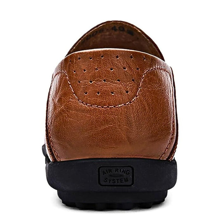 Perforated slip-on loafers with moc toe and flat treaded sole
