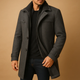 Men's structured winter coat with high collar, button and zip front, pockets and adjustable cuffs