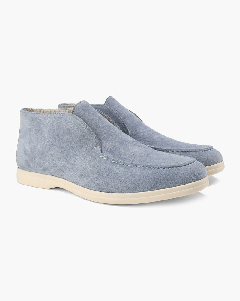 Unisex ankle-height slip-on loafers with rounded moc toes and stitched apron details