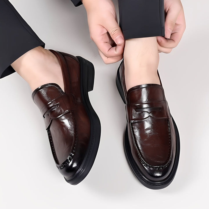 Men's formal loafers with moc toe stitching, penny strap and low heel