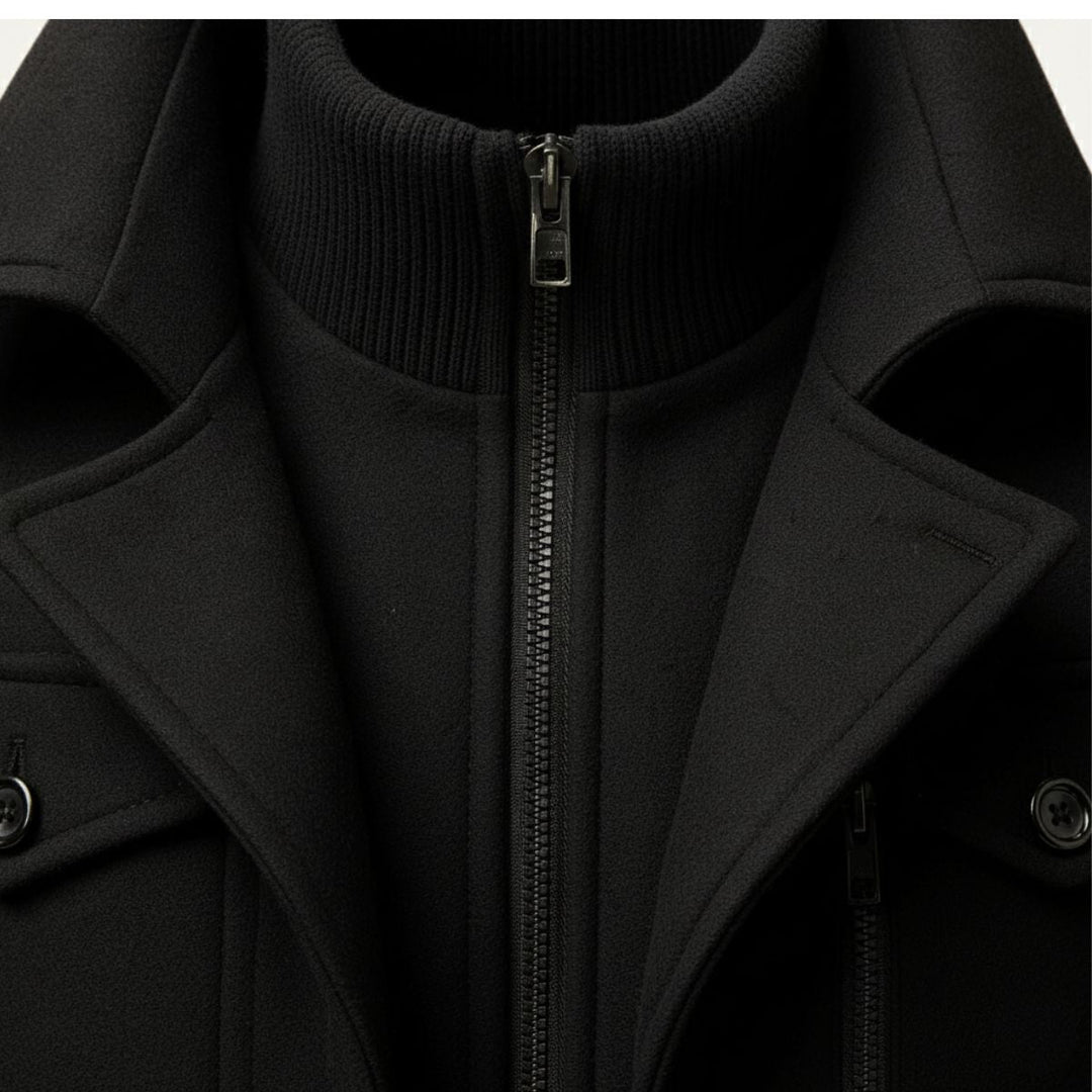 Men's long structured button coat with raised collar, chest pockets and cuff tabs