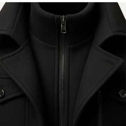 Men's long structured button coat with raised collar, chest pockets and cuff tabs