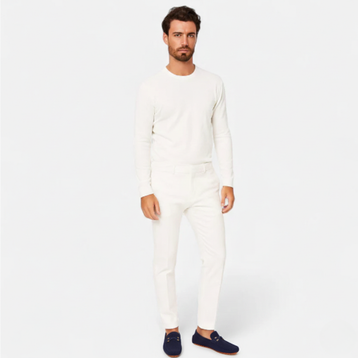 Men's perforated slip-on loafers with decorative vamp detail and flat ridged soles