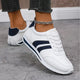 Unisex low-top casual sneakers with lace-up fronts