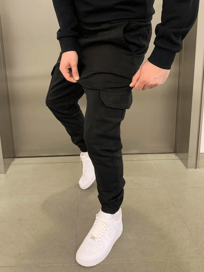 Men's tapered cargo trousers with drawstring waist, thigh pockets and elasticated cuffs