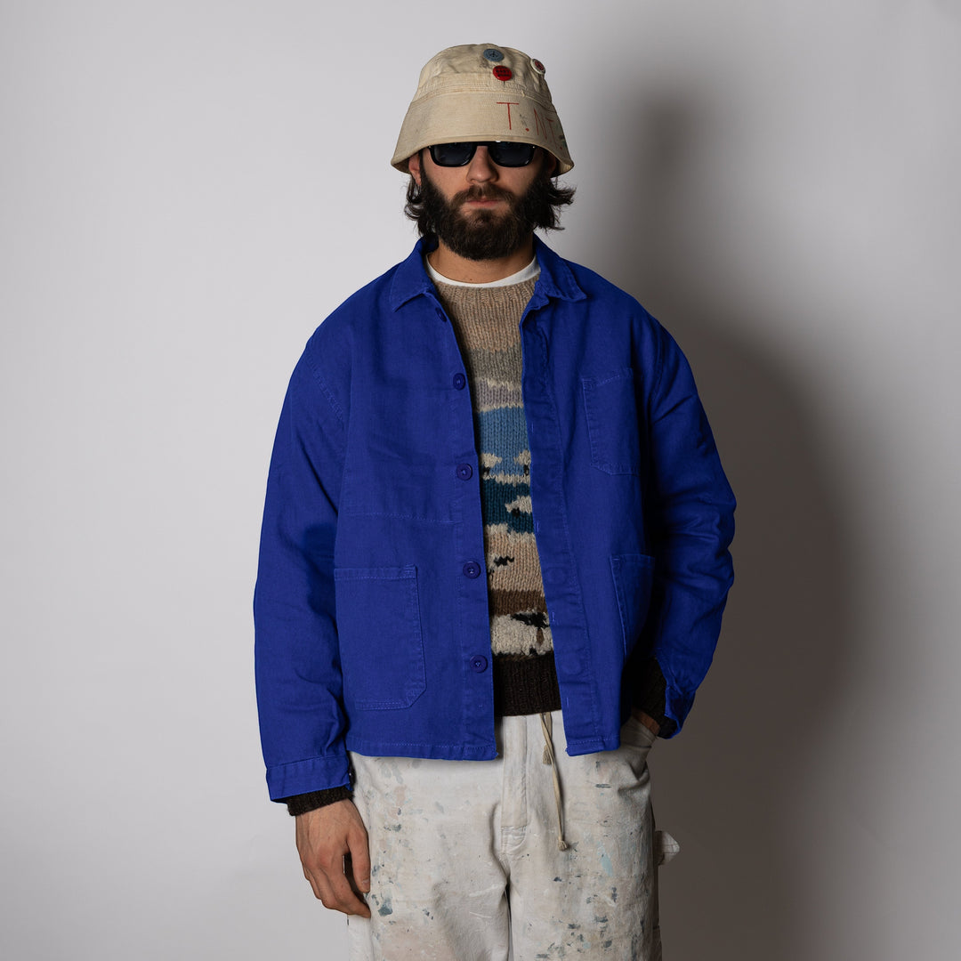 Men's blue collared work jacket with button front and patch pockets