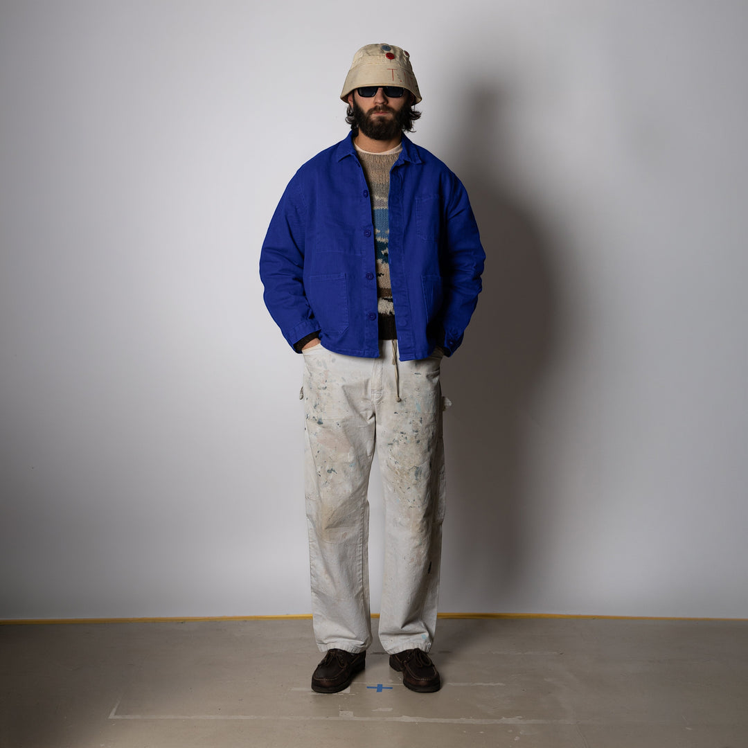 Men's blue collared work jacket with button front and patch pockets