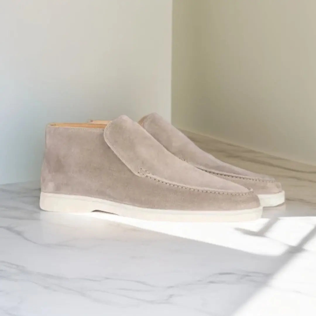 Men's slip-on loafers with stitched moccasin detailing and flat contrasting soles